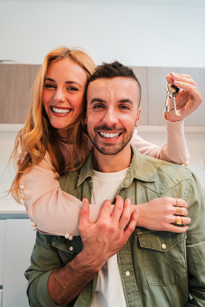 caucasian-couple-holding-and-showing key